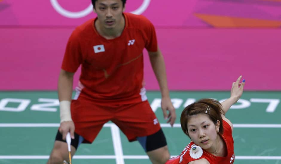 Japan's Reiko Shiota, right, and Shintaro Ikeda, play against Canada's Toby NG and Grace Gao, unseen, at a mixed doubles badminton match of the 2012 Summer Olympics.