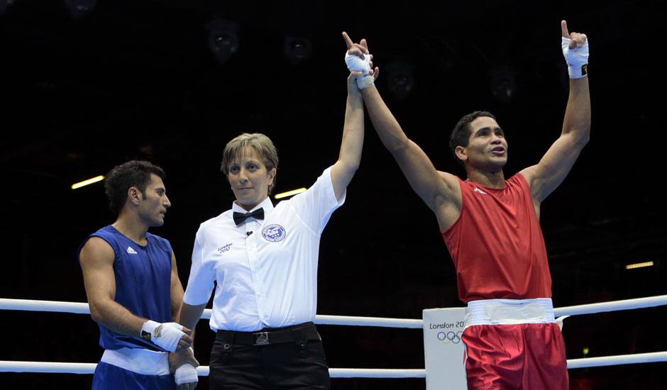 Venezuela's Gabriel Maestre Perez reacts after defeating Iran's Amin Ghasemi Pour during their men's welter 69-kg boxing match at the 2012 Summer Olympics.