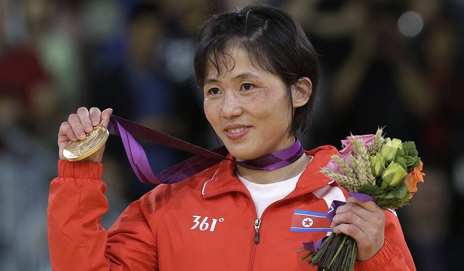 North Korea's An Kum Ae holds her gold medal in the women's 52-kg judo competition at the 2012 Summer Olympics.