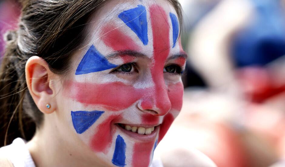 Milly Dutton, 12, of London watches a broadcast of an Olympic tennis match on a large screen at Park Live inside Olympic Park during the 2012 Summer Olympics in London.