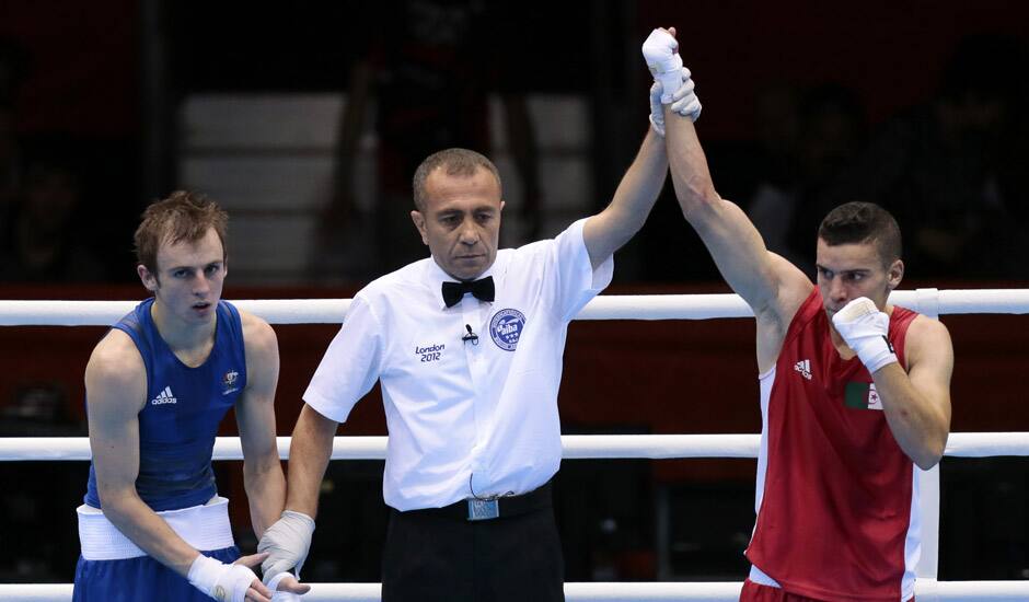 Algeria's Samir Brahimi,  reacts after defeating Australia's Jackson Woods in their men's flyweight 52-kg boxing match at the 2012 Summer Olympics in London.