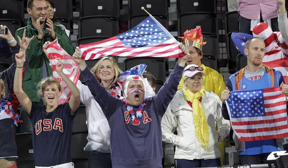 Fans cheer for the United States during a beach volleyball match against the Czech Republic at the 2012 Summer Olympics in London. 