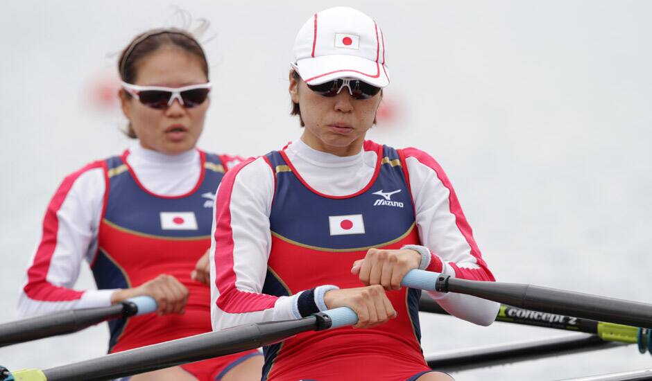 Japan's Akiko Iwamoto, and Atsumi Fukumoto stroke during their lightweight women's rowing double sculls repechage win Eton Dorney, near Windsor, England, at the 2012 Summer Olympics.