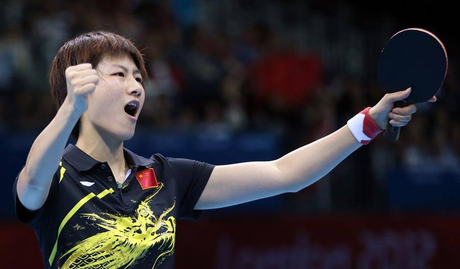 Ding Ning of China competes against Ai Fukuhara of Japan during the women's singles table tennis competition at the 2012 Summer Olympics.