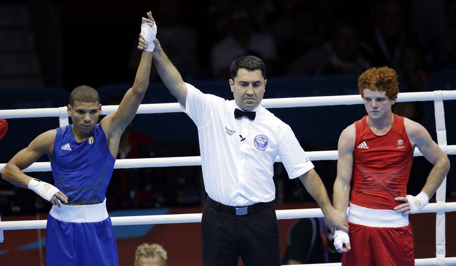 Cuba's Yosbany Veitia Soto, reacts after defeating Australia's Billy Ward during a light flyweight 49-kg preliminary boxing match at the 2012 Summer Olympics in London.