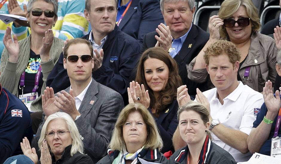 Britain's Prince William, his wife Kate Middleton the Duchess of Cambridge, and Prince Harry,  watch the show-jumping phase of the equestrian eventing competition at the 2012 Summer Olympics at Greenwich Park in London.