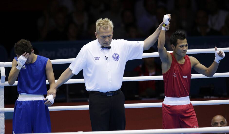 Devendro Singh Laishram, reacts after defeating Honduras' Bayron Molina Figueroa during a light flyweight 49-kg preliminary boxing match at the 2012 Summer Olympics in London.