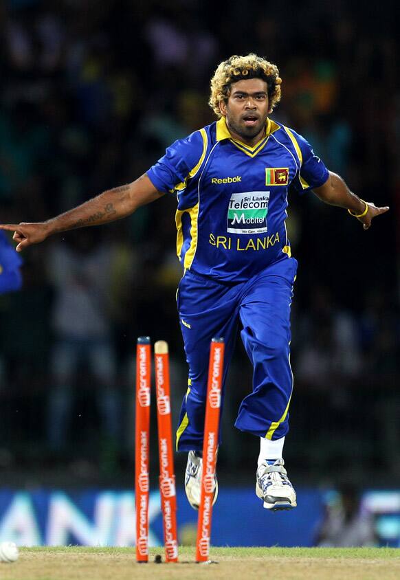 Sri Lanka's bowler Lasith Malinga celebrates the dismissal of India's batsman Gautam Gambhir, unseen during the fourth one-day international cricket match between India and Sri Lanka in Colombo.