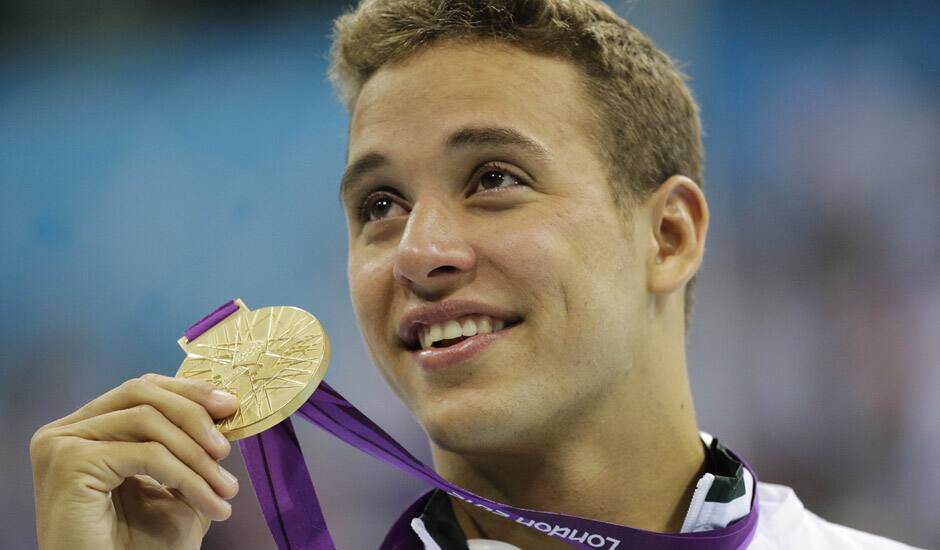 South Africa's Chad le Clos poses with his gold medal for the men's 200-meter butterfly swimming final at the Aquatics Centre in the Olympic Park during the 2012 Summer Olympics in London.