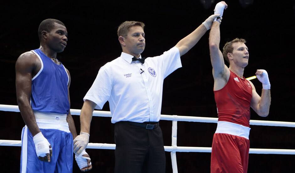 Australia's Jeffrey Horn, right, reacts after defeating Zambia's Gilbert Choombe in a men's light welter 64-kg boxing match at the 2012 Summer Olympics in London.