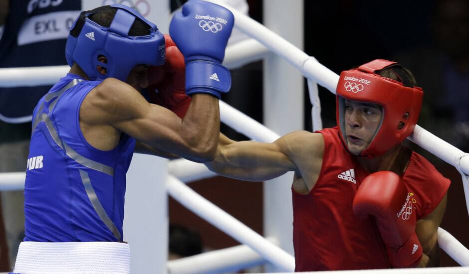 Sweden's Anthony Yigit, right, fights Puerto Rico's Francisco Vargas Ramirez during a light welterweight 64-kg preliminary boxing match at the 2012 Summer Olympics in London.