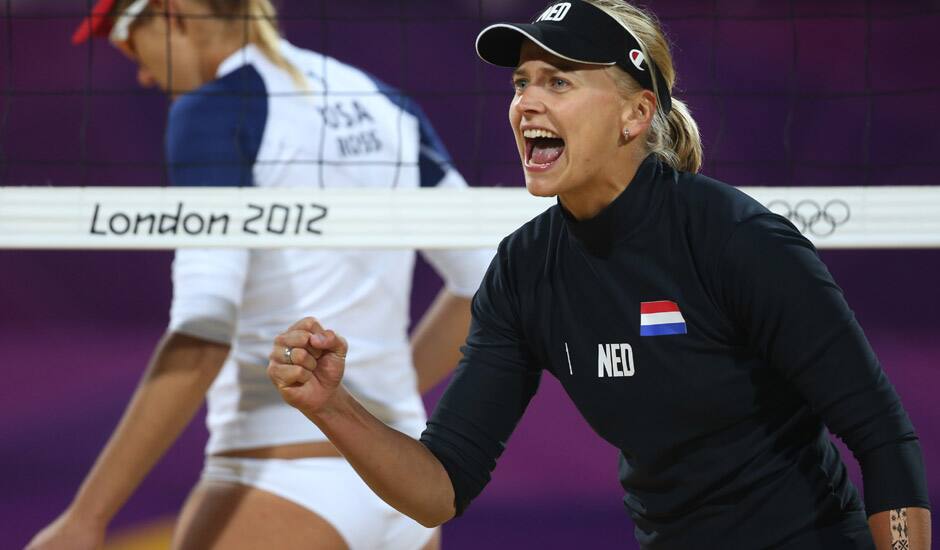 April Ross, left, of US and Marleen Van Iersel, right, from Netherlands react during the Beach Volleyball match against Netherlands at the 2012 Summer Olympics in London. 