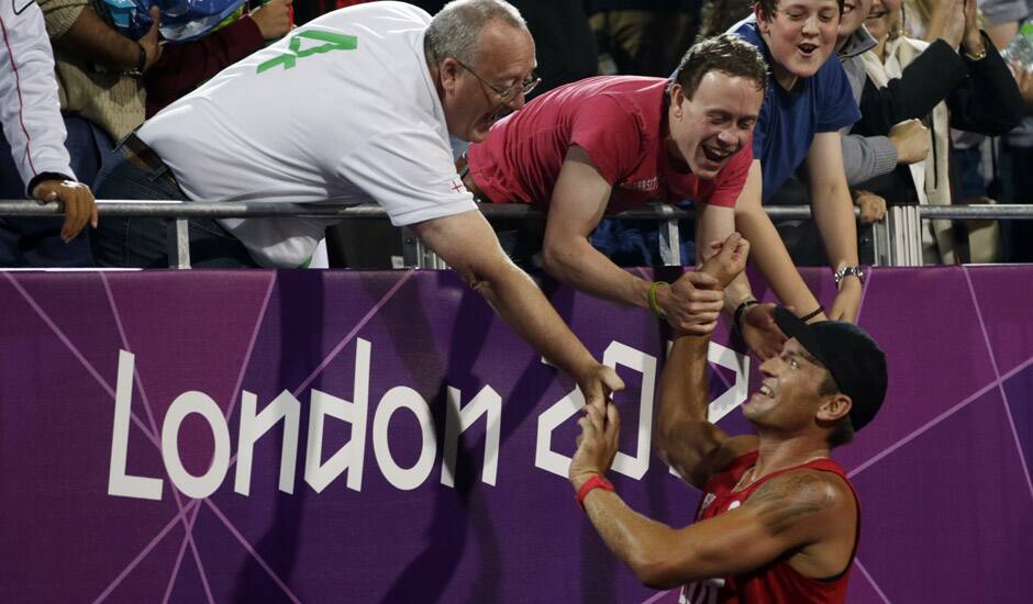 Alexander Horst of Austria reacts with fans at the end of a beach volleyball match win against Italy at the 2012 Summer Olympics in London. 