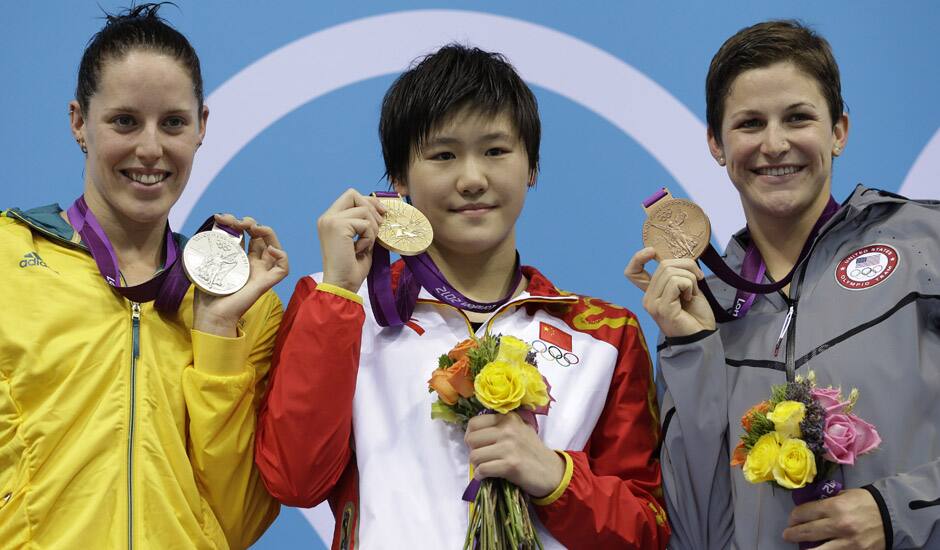 Australia's Alicia Coutts, left, China's Ye Shiwen, center, and the United States' Caitlin Leverenz pose with their medals for the women's 200-meter individual medley swimming final pose at the Aquatics Centre in the Olympic Park during the 2012 Summer Olympics in London.