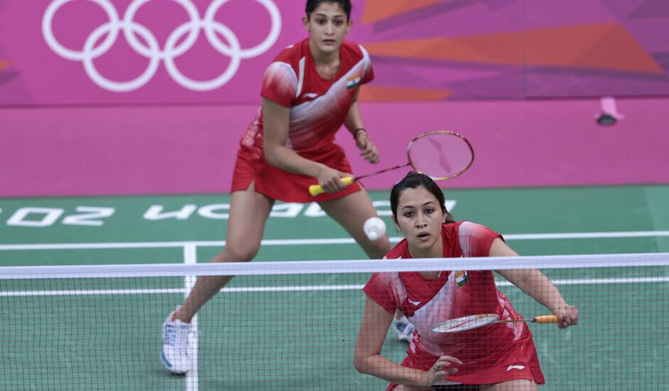 India's Ashwini Ponappa, left, and Jwala Gutta, play against Singapore's Sari Shinta Mulia and Yao Lei, unseen, at a women's doubles badminton match of the 2012 Summer Olympics in London.