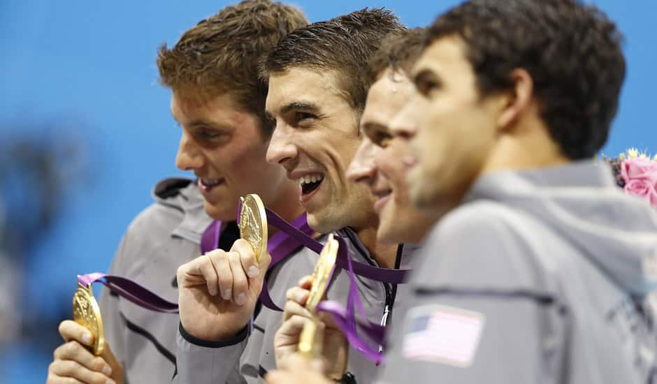 United States' Michael Phelps, center, pose with their gold medals after their win in the men's 4 x 200-meter freestyle relay at the Aquatics Centre in the Olympic Park during the 2012 Summer Olympics in London.