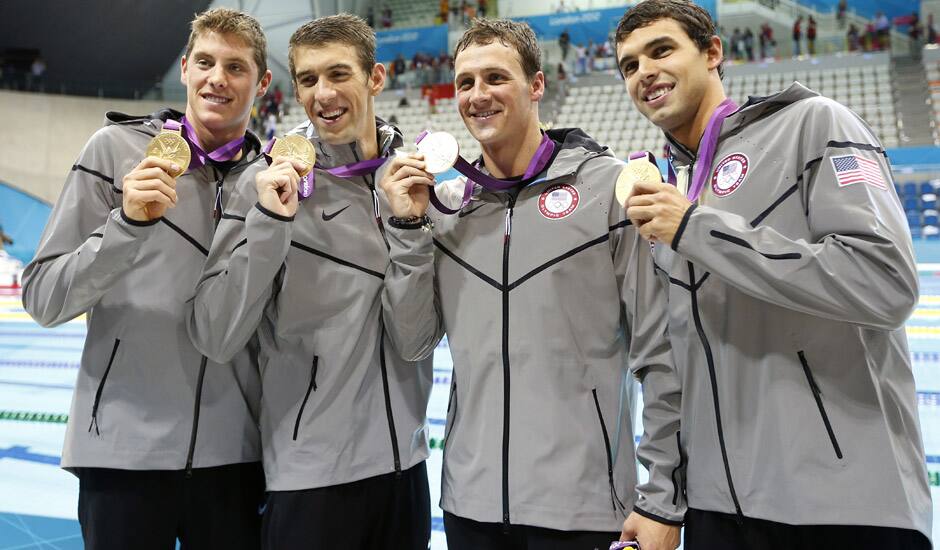 United States Michael Phelps, second from left, pose with his gold medal after their win in the men's 4 x 200-meter freestyle relay at the Aquatics Centre in the Olympic Park during the 2012 Summer Olympics in London.