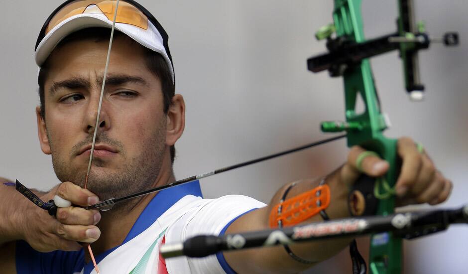 Italy's Mauro Nespoli shoots during an elimination round of the individual archery competition at the 2012 Summer Olympics in London. 