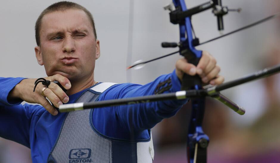 Ukraine's Viktor Ruban shoots during an elimination round of the individual archery competition at the 2012 Summer Olympics in London. 