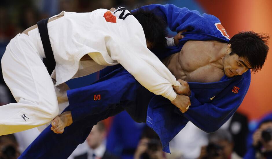 Masashi Nishiyama of Japan, left, and Chingiz Mamedov of Kyrgyzstan, compete during the men's 90-kg judo competition at the 2012 Summer Olympics in London.