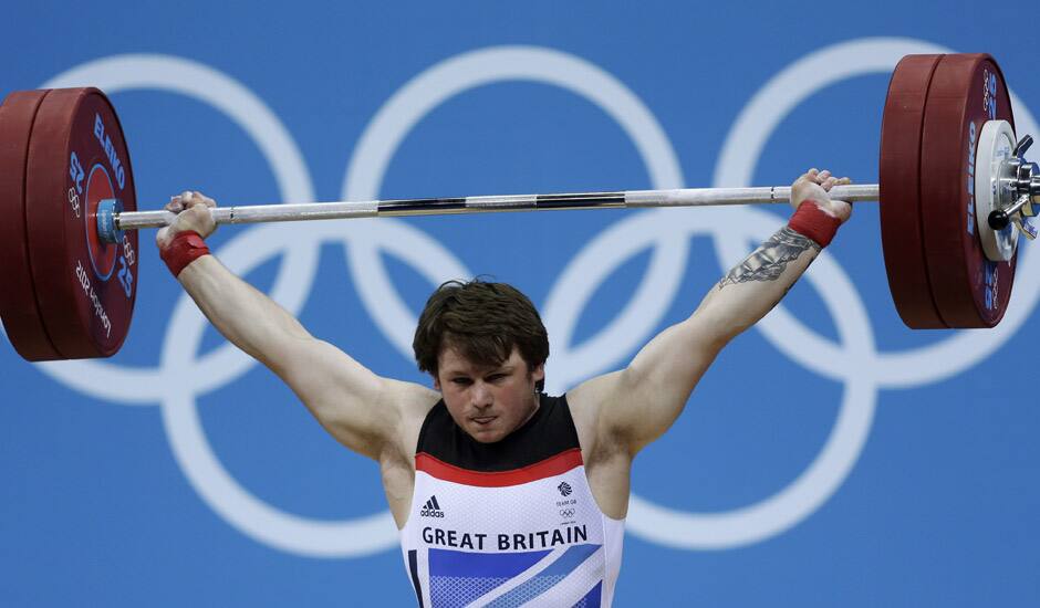 Great Britain's Jack Oliver competes during the men's 77-kg weightlifting competition at the 2012 Summer Olympics in London.