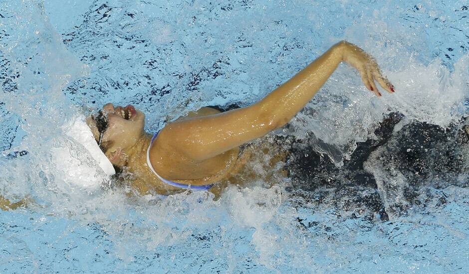 Syria's Bayan Jumah competes in a women's 100-meter freestyle swimming heat at the Aquatics Centre in the Olympic Park during the 2012 Summer Olympics in London.