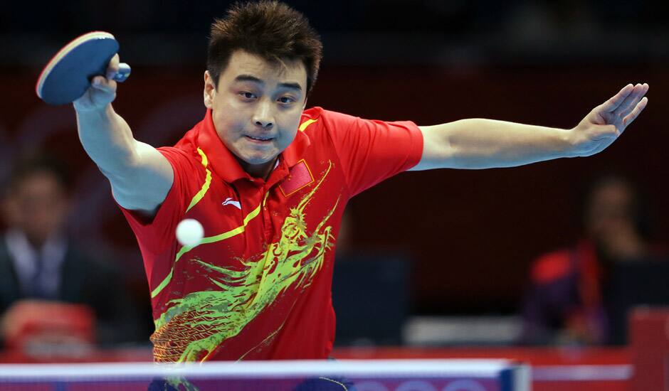 China's Hao Wang returns a shot during a quarterfinals men's table tennis match against Japan's Seiya Kishikawa at the 2012 Summer Olympics in London.