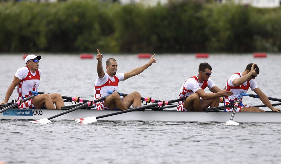 Croatia's, from right, Valent Sinkovic, Damir Martin, Martin Sinkovic and David Sain celebrate after winning a men's quadruple rowing sculls semifinal in Eton Dorney, near Windsor, England, at the 2012 Summer Olympics.