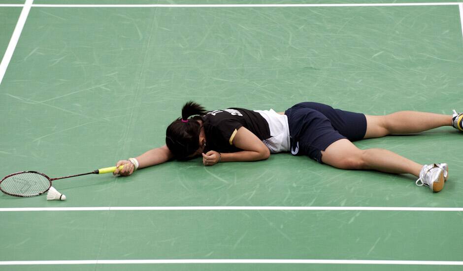 Taiwan's Tai Tzu-ying reacts after losing a women's singles badminton match against China's Li Xuerui at the 2012 Summer Olympics in London.