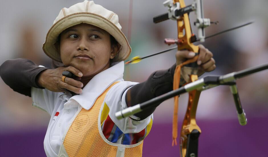 Indonesia's Ika Yuliana Rochmawati shoots during an elimination round of the individual archery competition at the 2012 Summer Olympics in London.