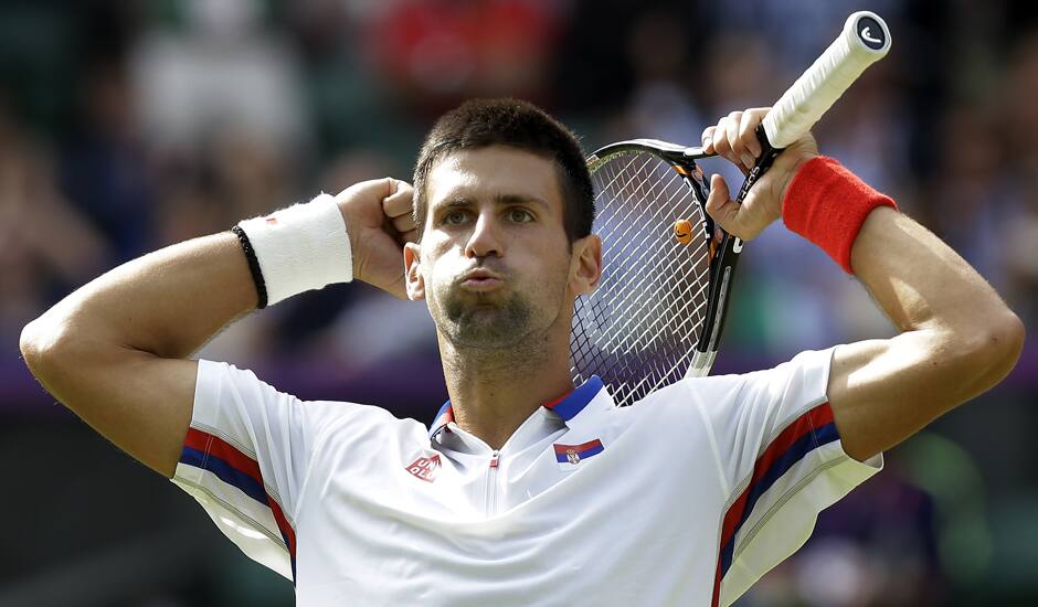 Novak Djokovic of Serbia celebrates his victory over Lleyton Hewitt of Australia at the All England Lawn Tennis Club in Wimbledon, London at the 2012 Summer Olympics.