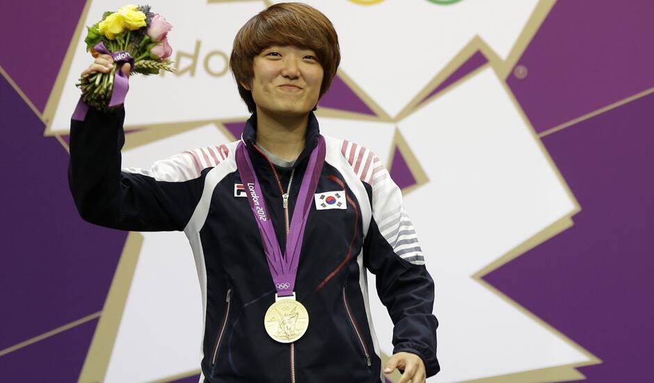 South Korea's Kim Jangmi reacts after firing her final shots and realizing she has won gold in the women's 25-meter pistol event, at the 2012 Summer Olympics.