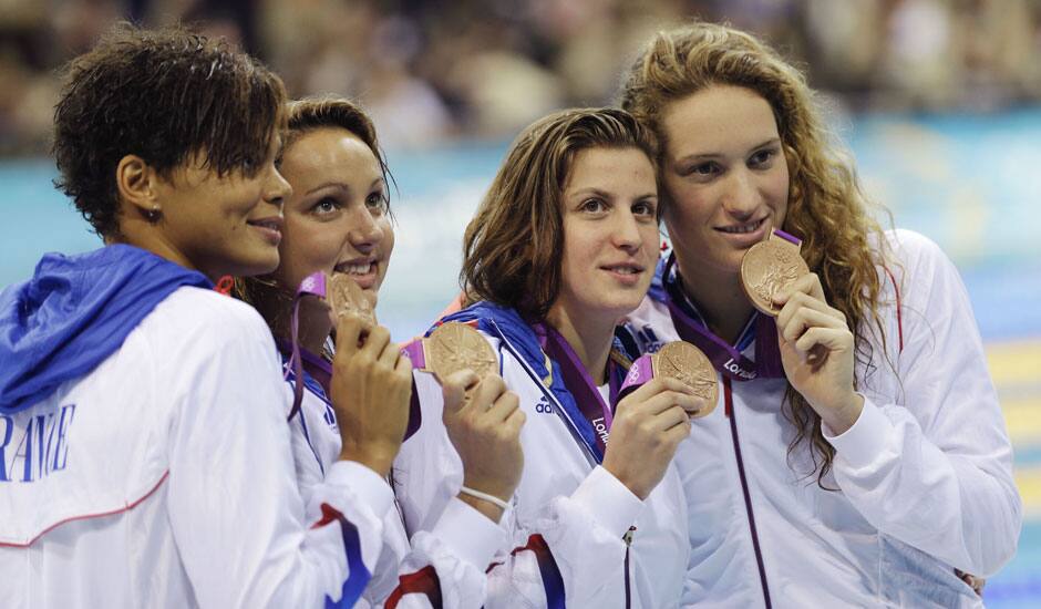 From right, France's Camille Muffat, France's Charlotte Bonnet, France's Ophelie-Cyrielle Etienne and France's Coralie Balmy pose with their bronze medals for the women's 4x200-meter freestyle relay swimming final at the Aquatics Centre in the Olympic Park during the 2012 Summer Olympics.