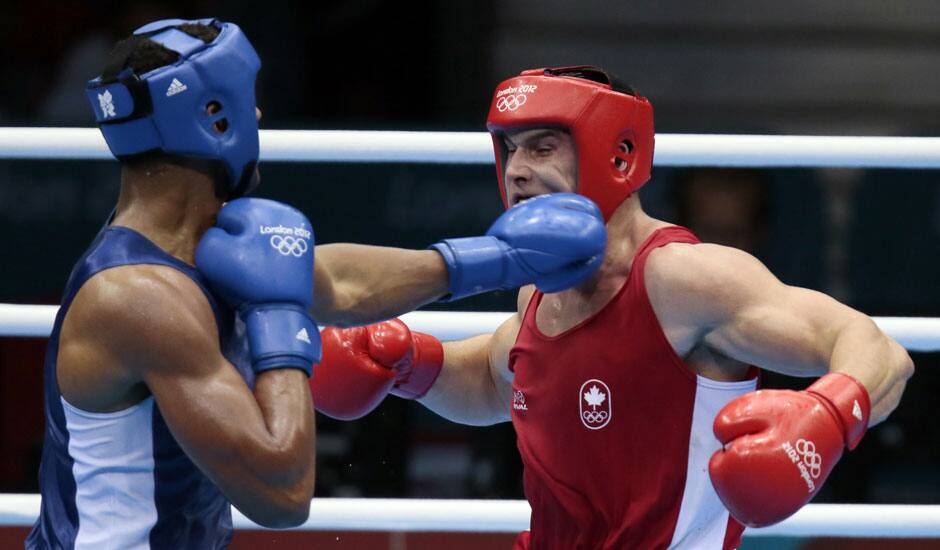 Canada's Simon Kean, right, fights France's Tony Yoka, during their men's super heavyweight over 91-kg boxing match at the 2012 Summer Olympics, in London. 