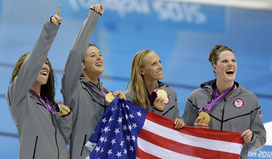 From right, United States' Missy Franklin, United States' Dana Vollmer, United States' Allison Schmitt and United States' Shannon Vreeland pose with their gold medals for the women's 4x200-meter freestyle relay swimming final at the Aquatics Centre in the Olympic Park during the 2012 Summer Olympics