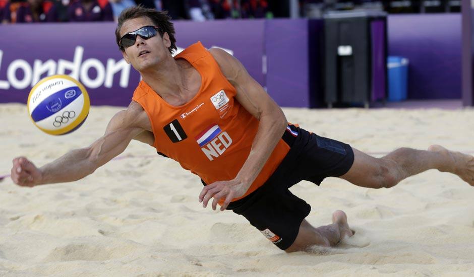 Reinder Nummerdor of the Netherlands goes for a dig during a 2 set loss to Latvia during a beach volleyball match at the 2012 Summer Olympics.