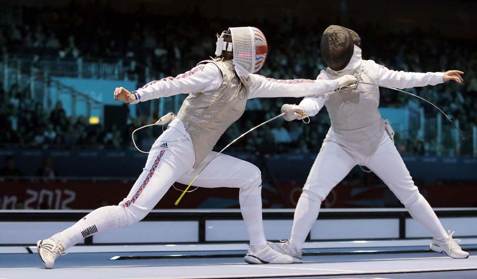 Britain's Sophie Troiano faces Egypt's Shaimaa Elgammal during a round of 16 match at women's team foil fencing at the 2012 Summer Olympics.