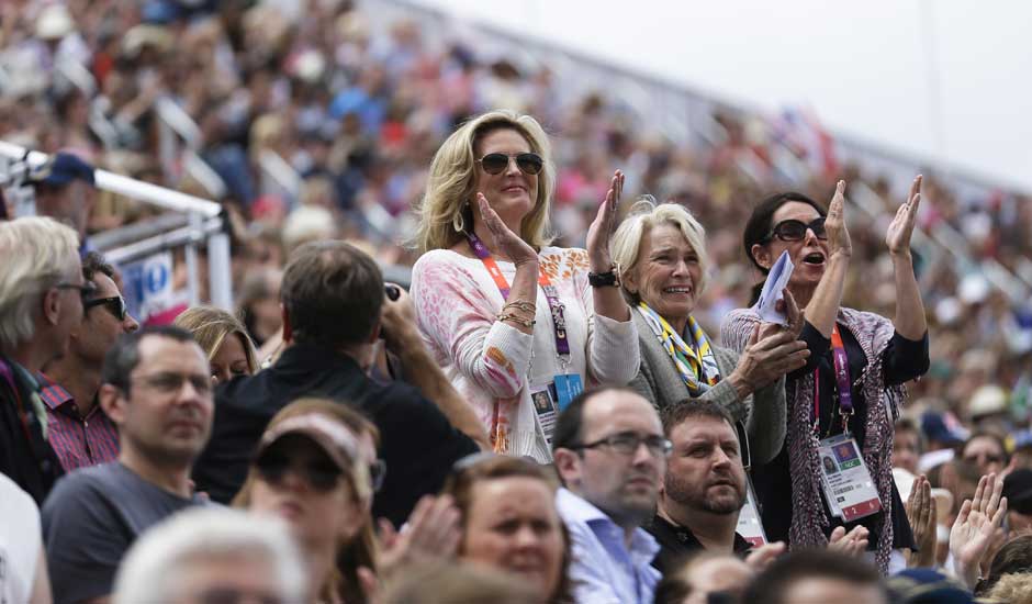 Ann Romney, left, the wife of U.S. Republican presidential candidate Mitt Romney applauses after her co-owned horse Rafalca attends in the equestrian dressage competition, at the 2012 Summer Olympics.