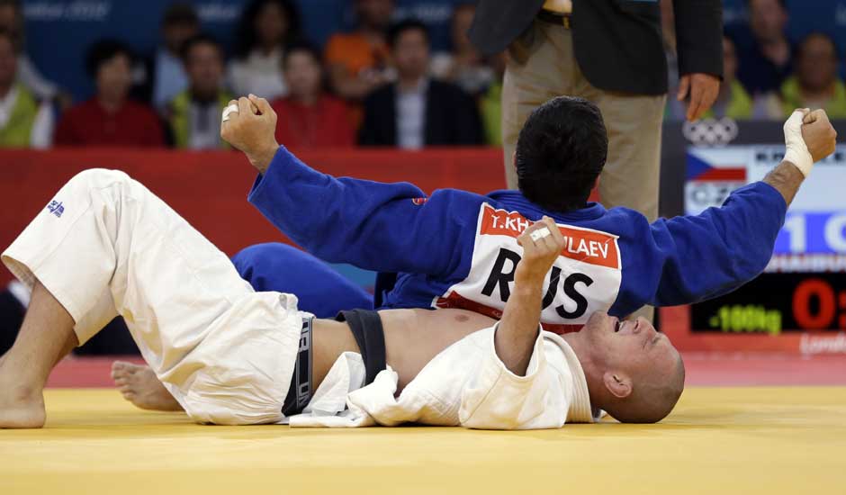 Czech Republic's Lukas Krpalek, in white, competes against Russia's Tagir Khaibulaev during the men's 100-kg judo competition at the 2012 Summer Olympics.