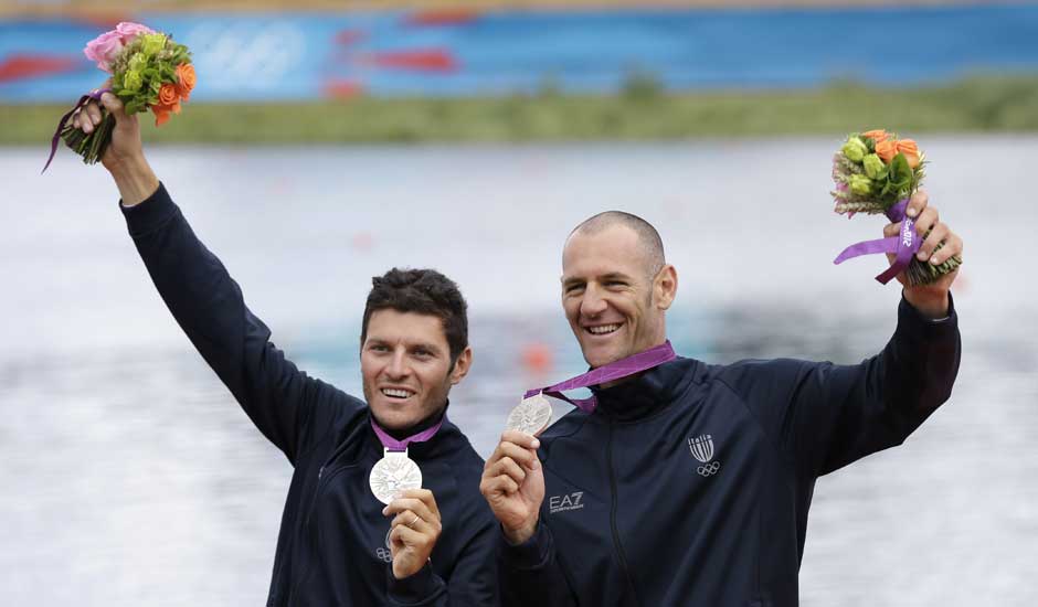 Italy's Romano Battisti, left, and Alessio Sartori celebrate after winning the silver medal for the men's rowing double sculls in Eton Dorney, near Windsor, England, at the 2012 Summer Olympics.