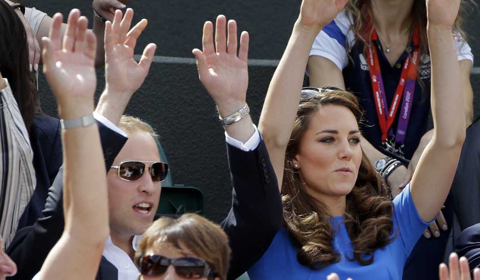 Prince William and Kate, Duchess of Cambridge, join the crowd in doing the wave at a match between Andy Murray of Great Britain and Nicolas Almagro of Spain at the All England Lawn Tennis Club at Wimbledon, in London.