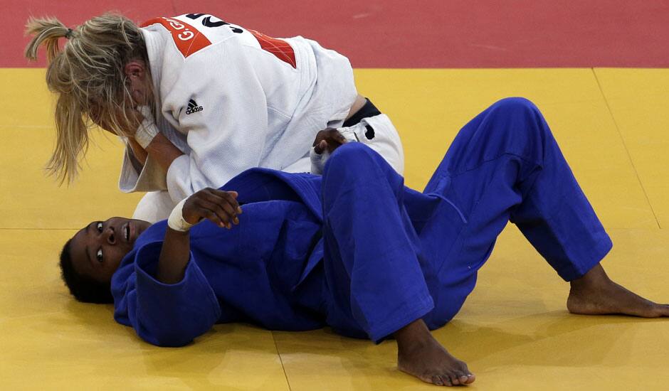 Gemma Gibbons of Great Britain reacts after winning her match against Audrey Tcheumeo of France during the women's 78-kg judo competition at the 2012 Summer Olympics.