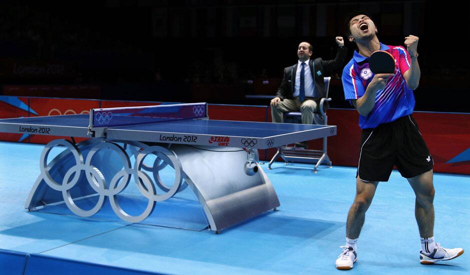 Chuang Chih-yuan of Taiwan, reacts against Dimitrij Ovtcharov of Germany, during the bronze medal match at men's singles table tennis at the 2012 Summer Olympics.