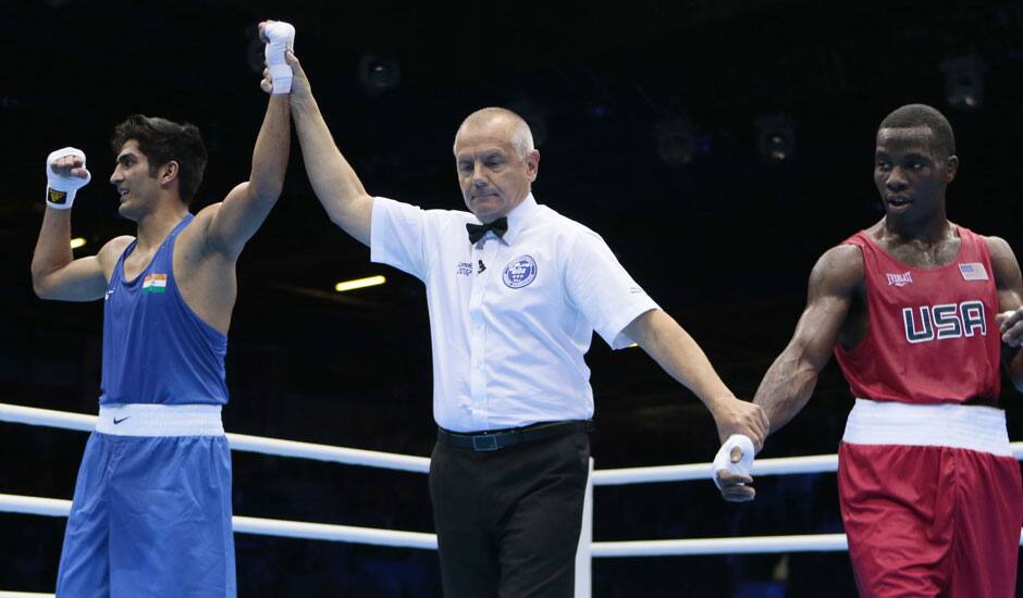 Vijender, left, reacts after defeating the United States' Terrell Gausha in a men's middle weight 75-kg boxing match at the 2012 Summer Olympics.