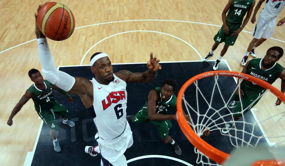 Lebron James of the United States (6) shoots against Tony Skinn (4) and Al-Farouq Aminu (7) of Nigeria during their men's basketball preliminary round match at the 2012 Summer Olympics.