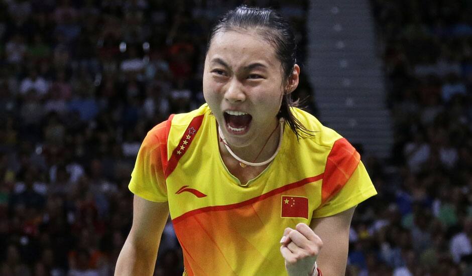 China's Wang Yihan celebrates after winning against Saina Nehwal at a women's singles badminton semifinal of the 2012 Summer Olympics.