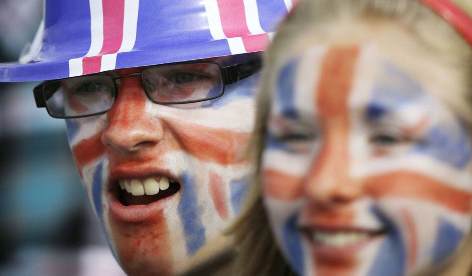 Fans of Great Britain watch the competition at the rowing venue in Eton Dorney, near Windsor, England, at the 2012 Summer Olympics.