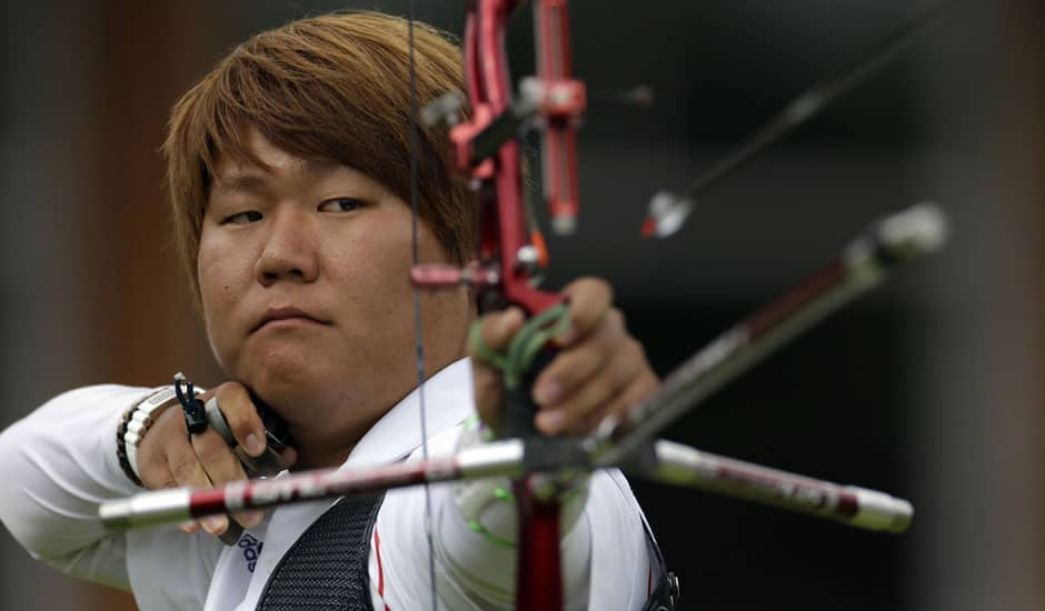 South Korea's Kim Bub-min shoots during the men's individual archery competition at the 2012 Summer Olympics in London.