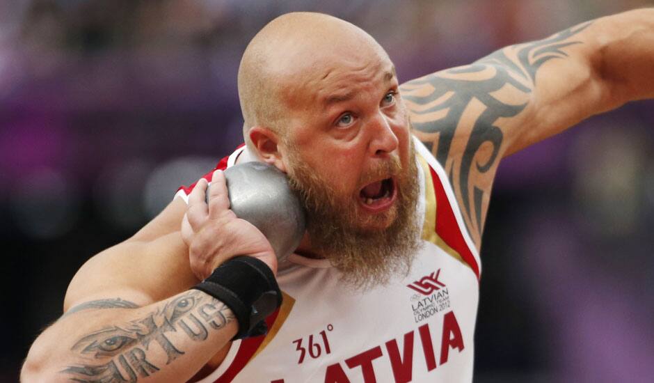 Latvia's Maris Urtans makes an attempt in the men's Shot Put qualification during the athletics in the Olympic Stadium at the 2012 Summer Olympics, London.