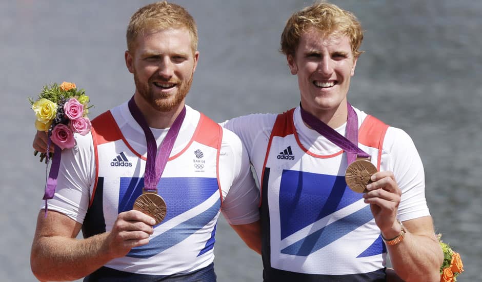 Great Britain's William Satch, and George Nash display the bronze medals they won in the men's rowing pair in Eton Dorney, near Windsor, England, at the 2012 Summer Olympics.